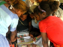 School children reading our fact sheets